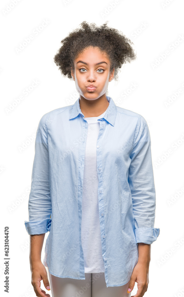 Young afro american woman over isolated background puffing cheeks with funny face. Mouth inflated with air, crazy expression. Young afro american woman over isolated background puffing cheeks with funny face. Mouth inflated with air, crazy expression.