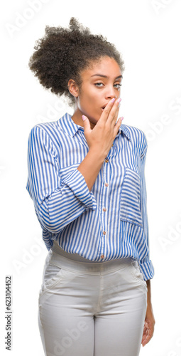 Young afro american woman over isolated background bored yawning tired covering mouth with hand. Restless and sleepiness.