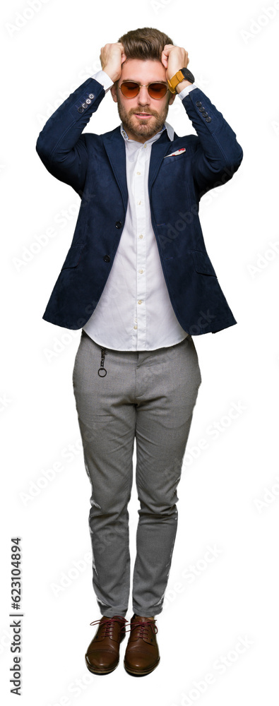 Young handsome elegant man wearing sunglasses and fashion blazer suffering from headache desperate and stressed because pain and migraine. Hands on head. Young handsome elegant man wearing sunglasses and fashion blazer suffering from headache desperate and stressed because pain and migraine. Hands on head.
