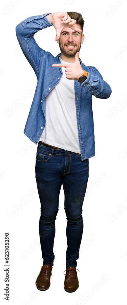 Young handsome blond man wearing casual denim jacket smiling making frame with hands and fingers with happy face. Creativity and photography concept. Young handsome blond man wearing casual denim jacket smiling making frame with hands and fingers with happy face. Creativity and photography concept.