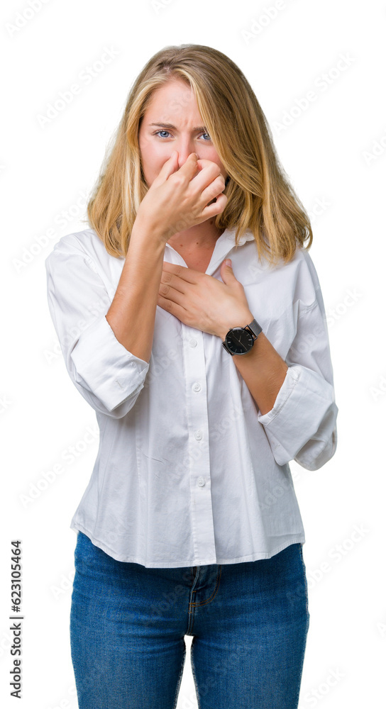 Beautiful young business woman over isolated background smelling something stinky and disgusting, intolerable smell, holding breath with fingers on nose. Bad smells concept. Beautiful young business woman over isolated background smelling something stinky and disgusting, intolerable smell, holding breath with fingers on nose. Bad smells concept.