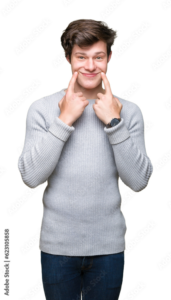 Young handsome man wearing winter sweater over isolated background Smiling with open mouth, fingers pointing and forcing cheerful smile Young handsome man wearing winter sweater over isolated background Smiling with open mouth, fingers pointing and forcing cheerful smile
