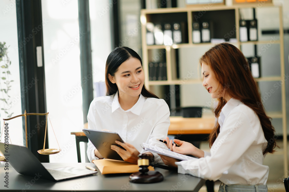 business Asian people and lawyers discussing contract papers sitting at the table. Concepts of law, advice, legal services. business Asian people and lawyers discussing contract papers sitting at the table. Concepts of law, advice, legal services.