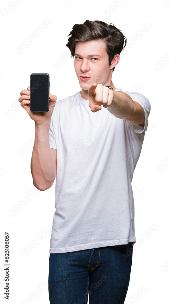 Young man showing smartphone screen over isolated background pointing with finger to the camera and to you, hand sign, positive and confident gesture from the front Young man showing smartphone screen over isolated background pointing with finger to the camera and to you, hand sign, positive and confident gesture from the front