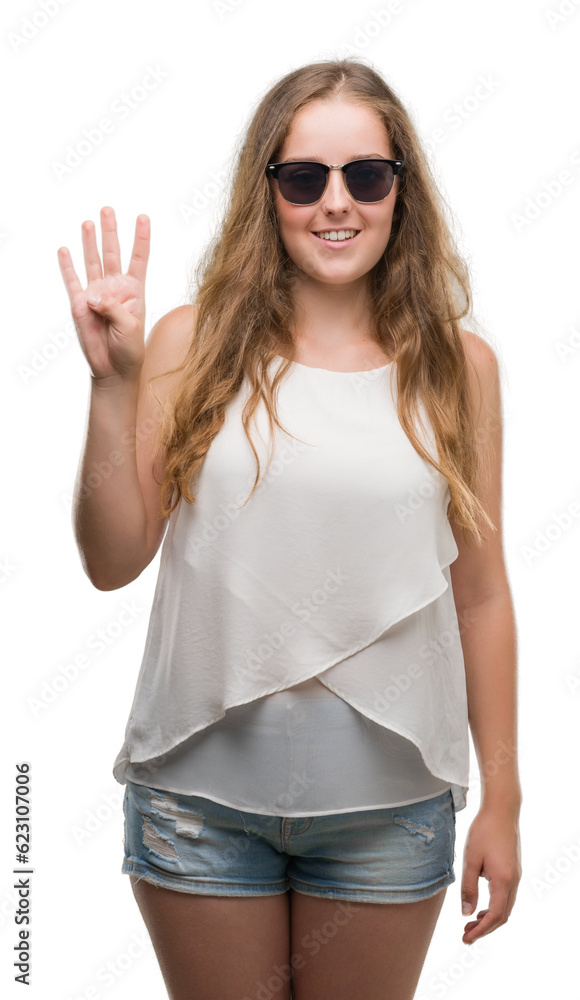 Young blonde woman wearing sunglasses showing and pointing up with fingers number four while smiling confident and happy. Young blonde woman wearing sunglasses showing and pointing up with fingers number four while smiling confident and happy.