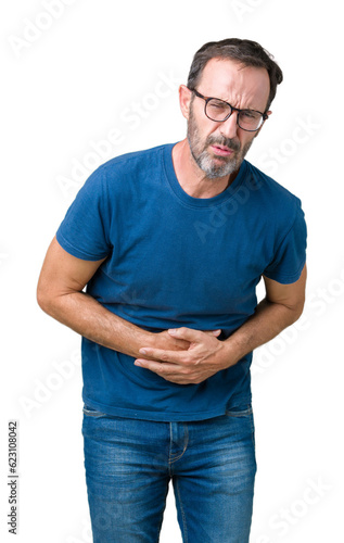 Handsome middle age hoary senior man wearin glasses over isolated background with hand on stomach because nausea, painful disease feeling unwell. Ache concept.