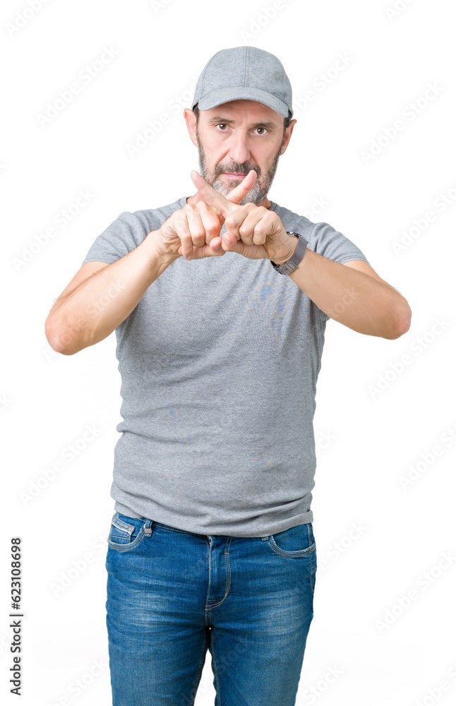 Handsome middle age hoary senior man wearing sport cap over isolated background Rejection expression crossing fingers doing negative sign Handsome middle age hoary senior man wearing sport cap over isolated background Rejection expression crossing fingers doing negative sign