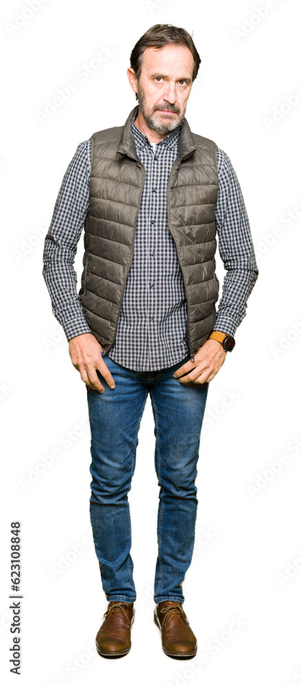 Middle age handsome man wearing winter vest skeptic and nervous, frowning upset because of problem. Negative person. Middle age handsome man wearing winter vest skeptic and nervous, frowning upset because of problem. Negative person.