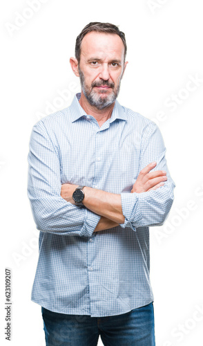 Middle age hoary senior business man over isolated background with serious expression on face. Simple and natural looking at the camera. © Krakenimages.com
