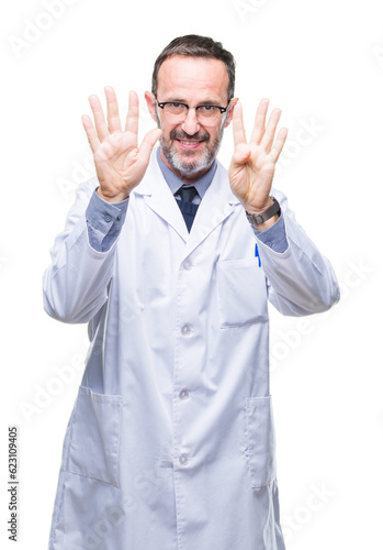 Middle age senior hoary professional man wearing white coat over isolated background showing and pointing up with fingers number nine while smiling confident and happy. © Krakenimages.com