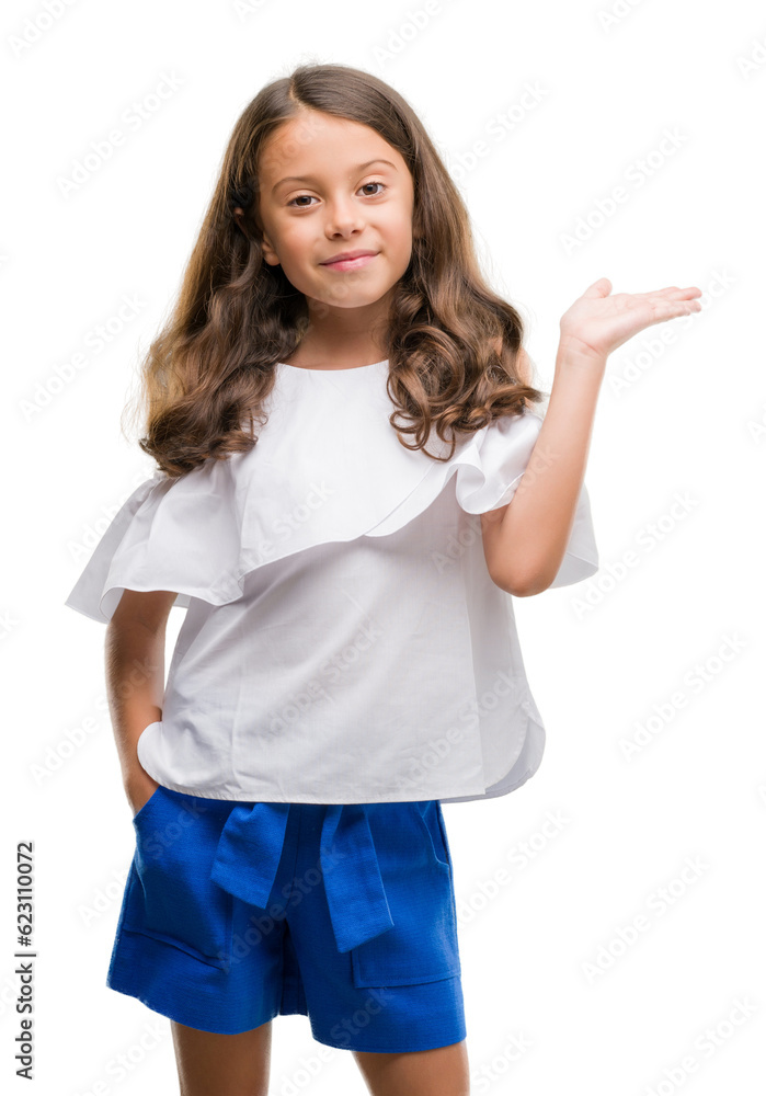 Brunette hispanic girl smiling cheerful presenting and pointing with palm of hand looking at the camera. Brunette hispanic girl smiling cheerful presenting and pointing with palm of hand looking at the camera.