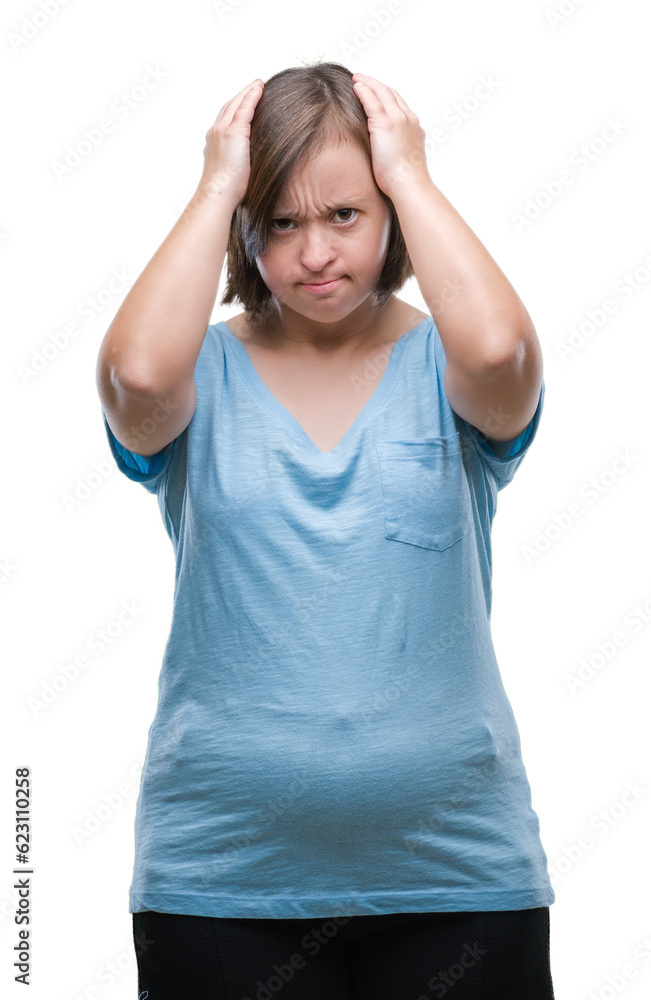 Young adult woman with down syndrome over isolated background suffering from headache desperate and stressed because pain and migraine. Hands on head. Young adult woman with down syndrome over isolated background suffering from headache desperate and stressed because pain and migraine. Hands on head.