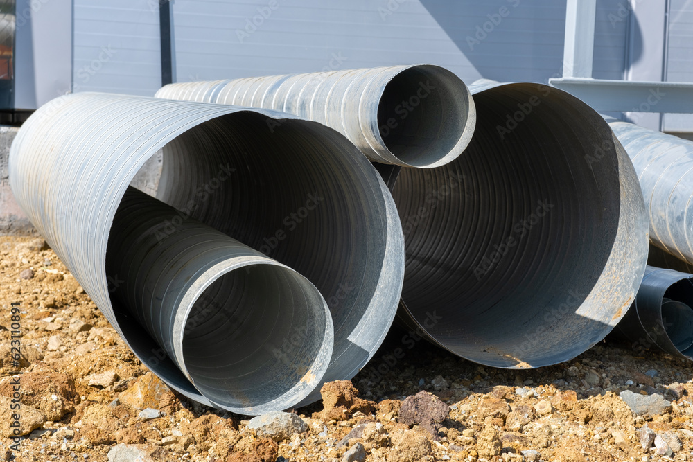 Sheet metal spiral duct in industrial manufacturing warehouse. Ventilation system for large buildings Sheet metal spiral duct in industrial manufacturing warehouse. Ventilation system for large buildings