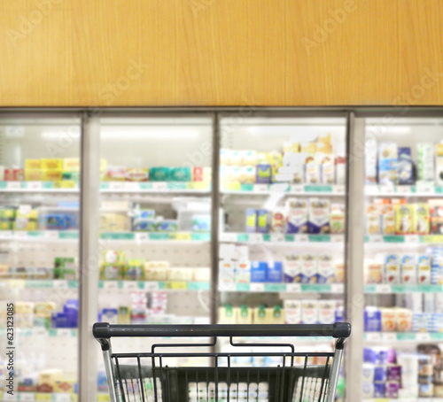 Choosing food from shelf in supermarket,vegetables in grocery section,empty grocery cart in an empty supermarket