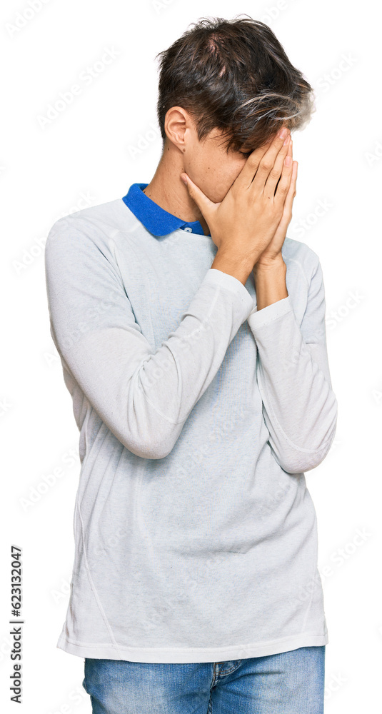 Young hispanic man wearing casual clothes with sad expression covering face with hands while crying. depression concept. Young hispanic man wearing casual clothes with sad expression covering face with hands while crying. depression concept.