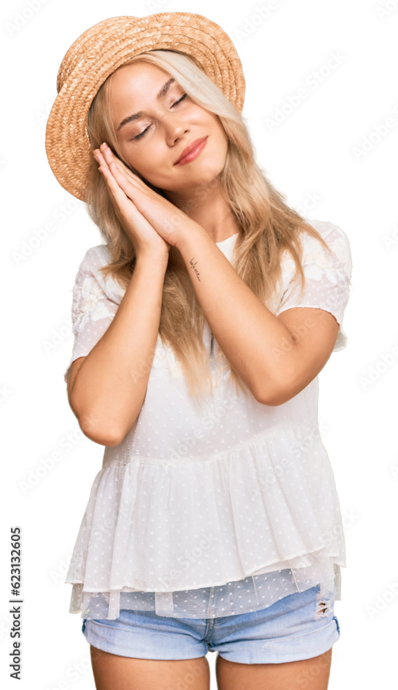 Young blonde girl wearing summer hat sleeping tired dreaming and posing with hands together while smiling with closed eyes. Young blonde girl wearing summer hat sleeping tired dreaming and posing with hands together while smiling with closed eyes.