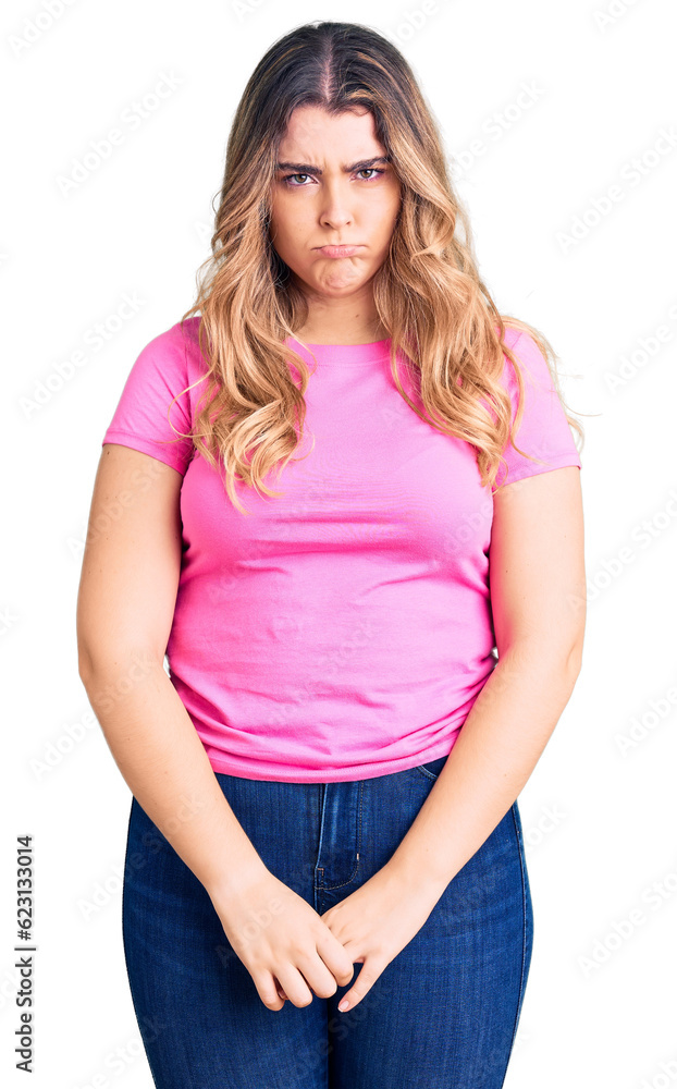 Fototapeta premium Young caucasian woman wearing sportswear depressed and worry for distress, crying angry and afraid. sad expression.