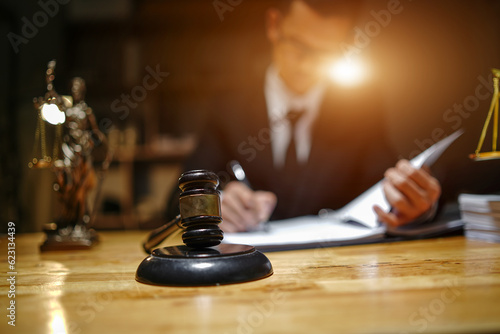  lawyers or attorneys discussing a contract agreement. Successful businessmen have a contract in place to protect it,signing of modest agreements form in office...