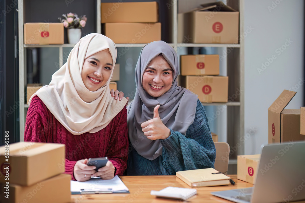Young muslim online business team working together, showing a thumbs up sign. good job, excellent, awesome gesture Young muslim online business team working together, showing a thumbs up sign. good job, excellent, awesome gesture