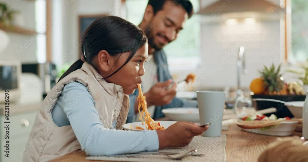 Father, children and a daughter eating spaghetti with her family in the dining room of their home together for supper. Food, girl child and dad at a table for a meal, bonding over dinner in a house Father, children and a daughter eating spaghetti with her family in the dining room of their home together for supper. Food, girl child and dad at a table for a meal, bonding over dinner in a house