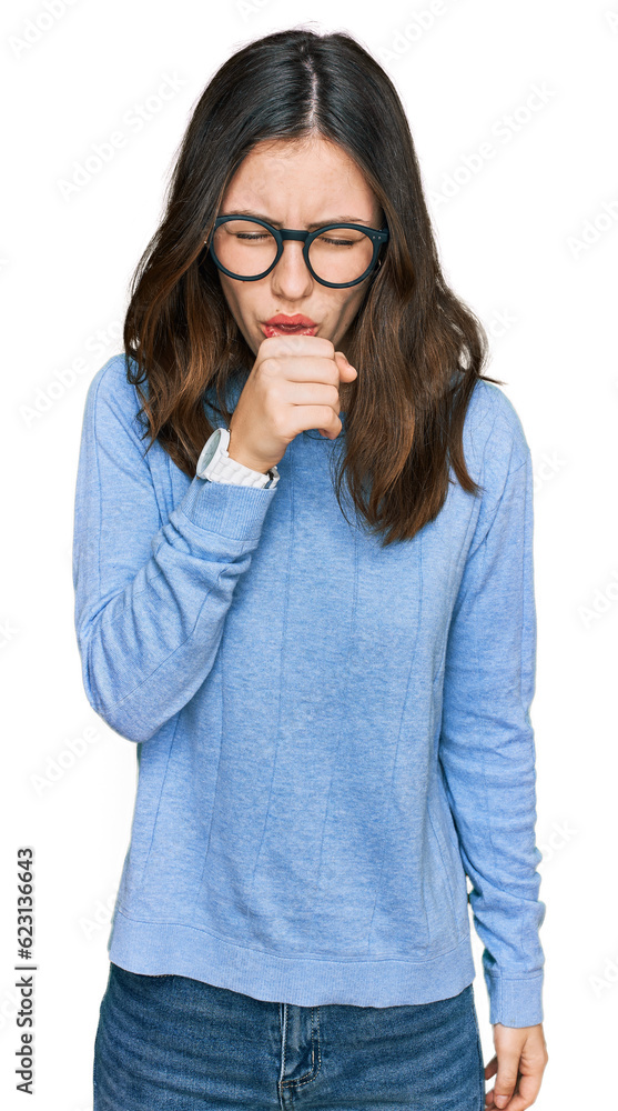 Young beautiful woman wearing casual clothes and glasses feeling unwell and coughing as symptom for cold or bronchitis. health care concept. Young beautiful woman wearing casual clothes and glasses feeling unwell and coughing as symptom for cold or bronchitis. health care concept.