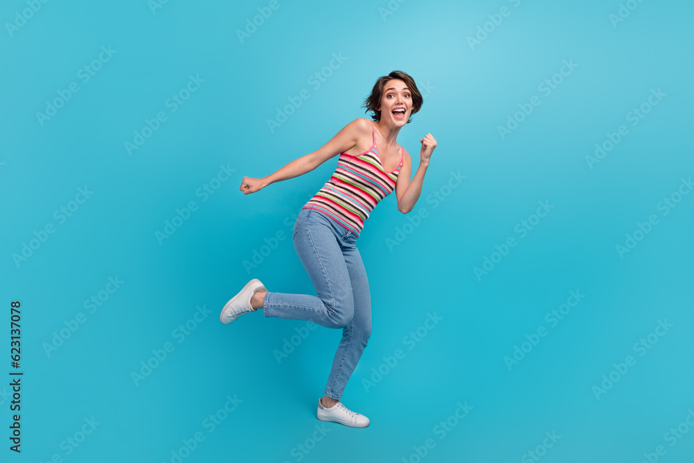Full body portrait of lovely young lady have good mood dancing chilling clubbing isolated on blue color background