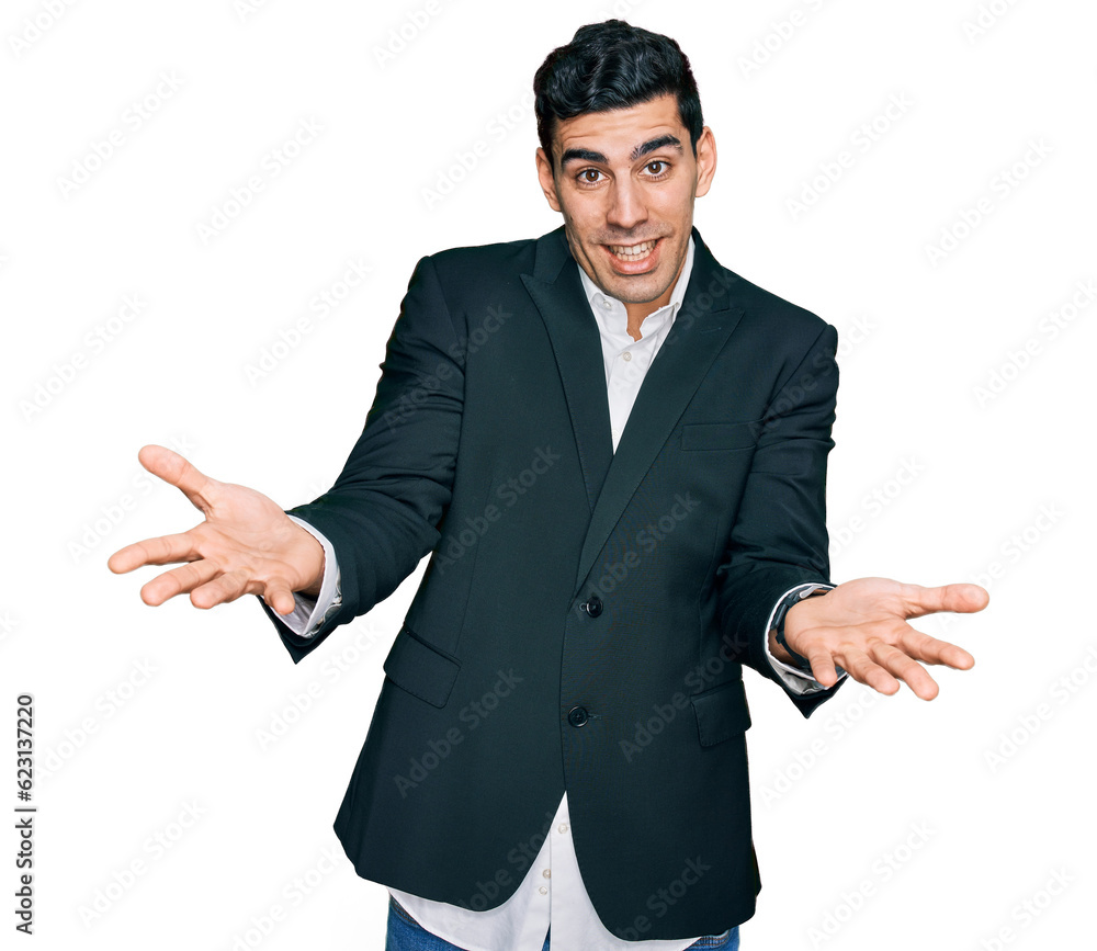 Handsome hispanic man wearing business clothes smiling cheerful offering hands giving assistance and acceptance. Handsome hispanic man wearing business clothes smiling cheerful offering hands giving assistance and acceptance.