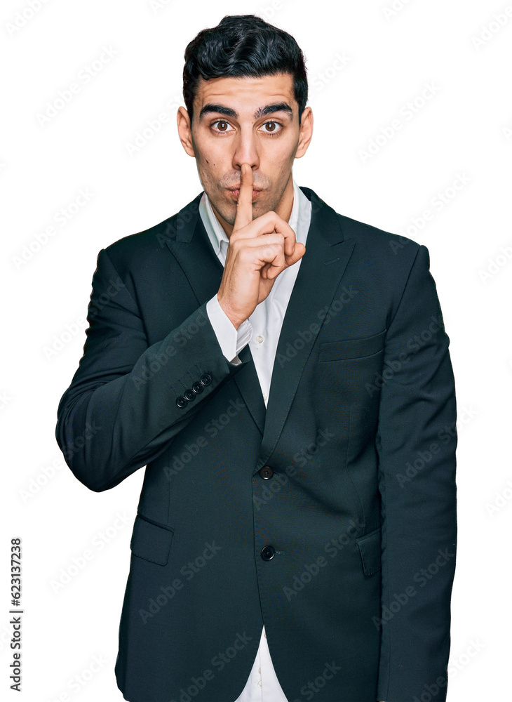 Handsome hispanic man wearing business clothes asking to be quiet with finger on lips. silence and secret concept. Handsome hispanic man wearing business clothes asking to be quiet with finger on lips. silence and secret concept.