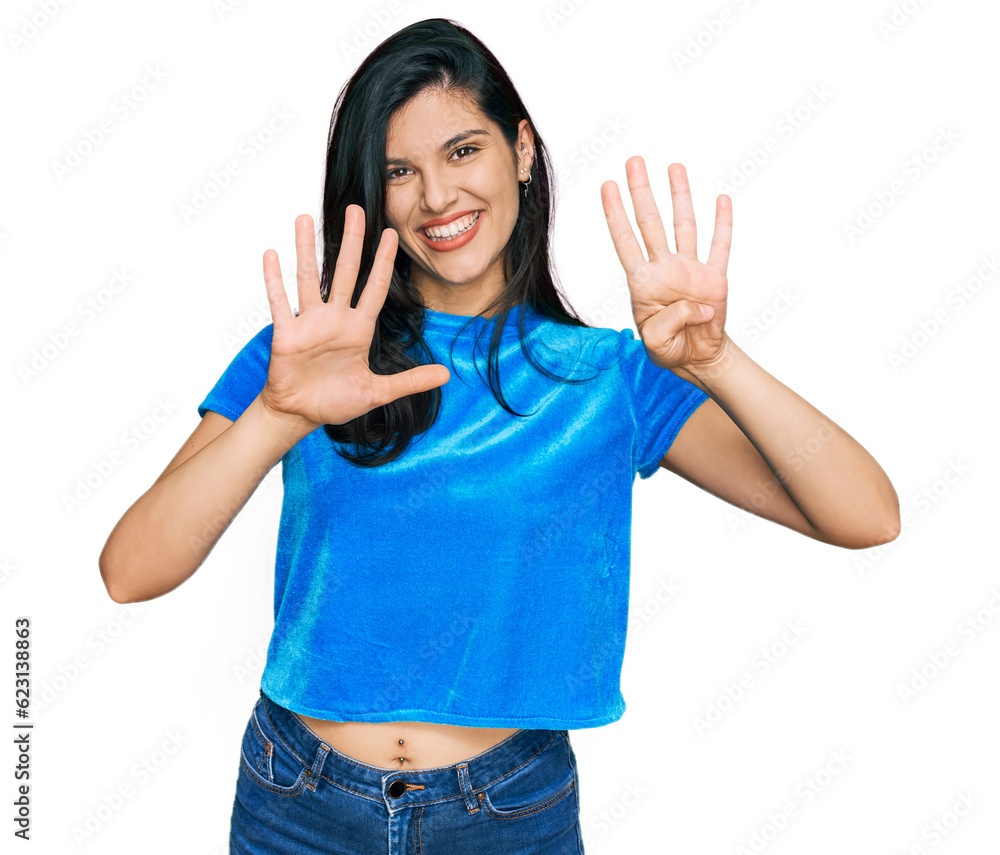 Young hispanic woman wearing casual clothes showing and pointing up with fingers number nine while smiling confident and happy. Young hispanic woman wearing casual clothes showing and pointing up with fingers number nine while smiling confident and happy.