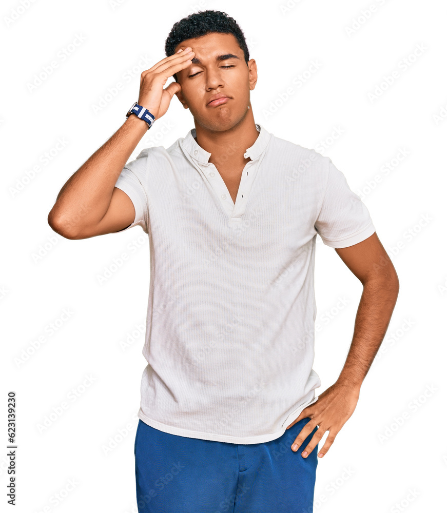 Young arab man wearing casual clothes worried and stressed about a problem with hand on forehead, nervous and anxious for crisis Young arab man wearing casual clothes worried and stressed about a problem with hand on forehead, nervous and anxious for crisis