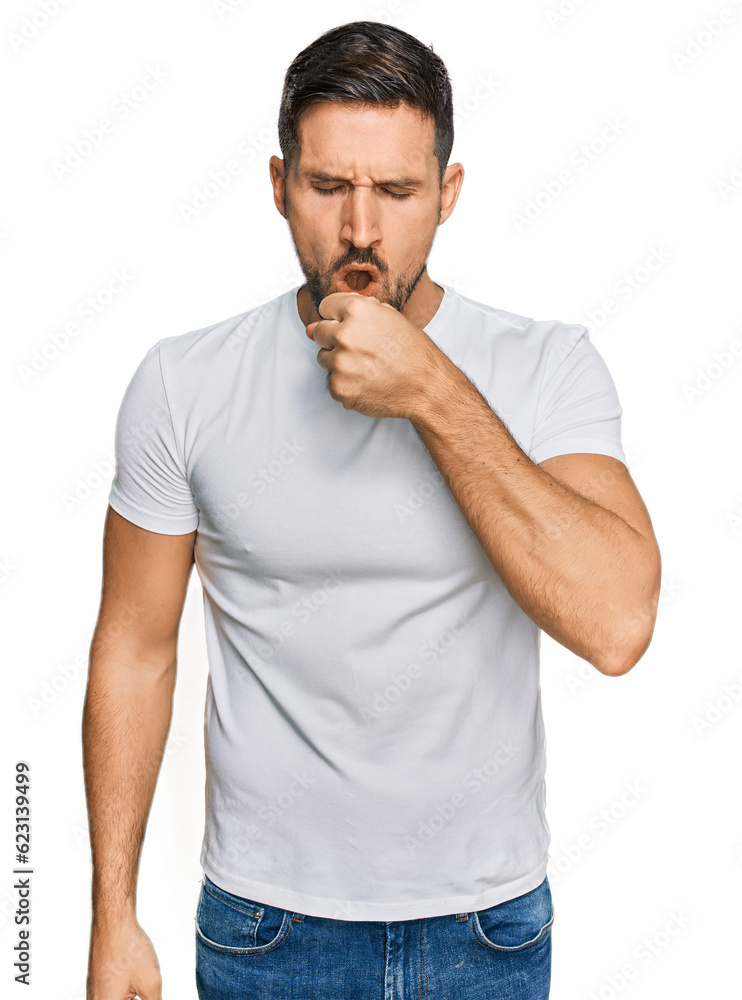 Handsome man with beard wearing casual white t shirt feeling unwell and coughing as symptom for cold or bronchitis. health care concept. Handsome man with beard wearing casual white t shirt feeling unwell and coughing as symptom for cold or bronchitis. health care concept.