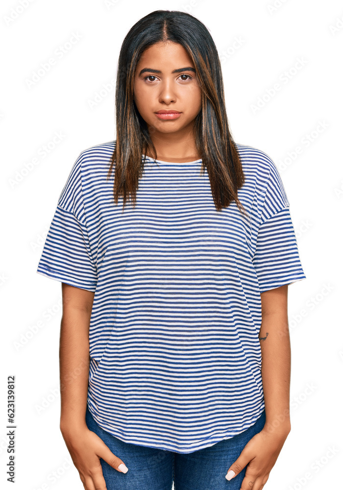 Fototapeta premium Young latin girl wearing casual clothes depressed and worry for distress, crying angry and afraid. sad expression.