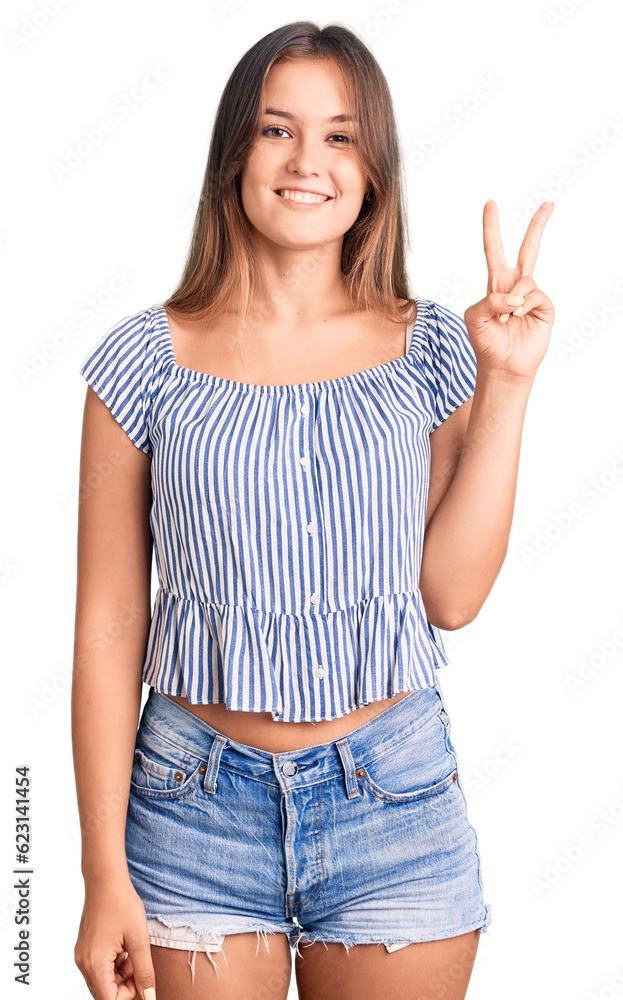 Beautiful caucasian woman wearing casual clothes smiling with happy face winking at the camera doing victory sign. number two. Beautiful caucasian woman wearing casual clothes smiling with happy face winking at the camera doing victory sign. number two.