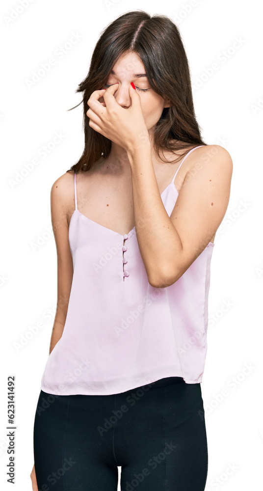 Young beautiful caucasian girl wearing casual clothes tired rubbing nose and eyes feeling fatigue and headache. stress and frustration concept. Young beautiful caucasian girl wearing casual clothes tired rubbing nose and eyes feeling fatigue and headache. stress and frustration concept.