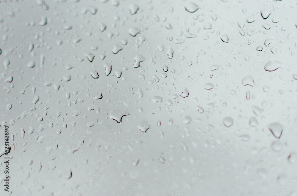 Water droplets on the window and some out of focus. Background.
Water droplets on the window and some out of focus. Background.