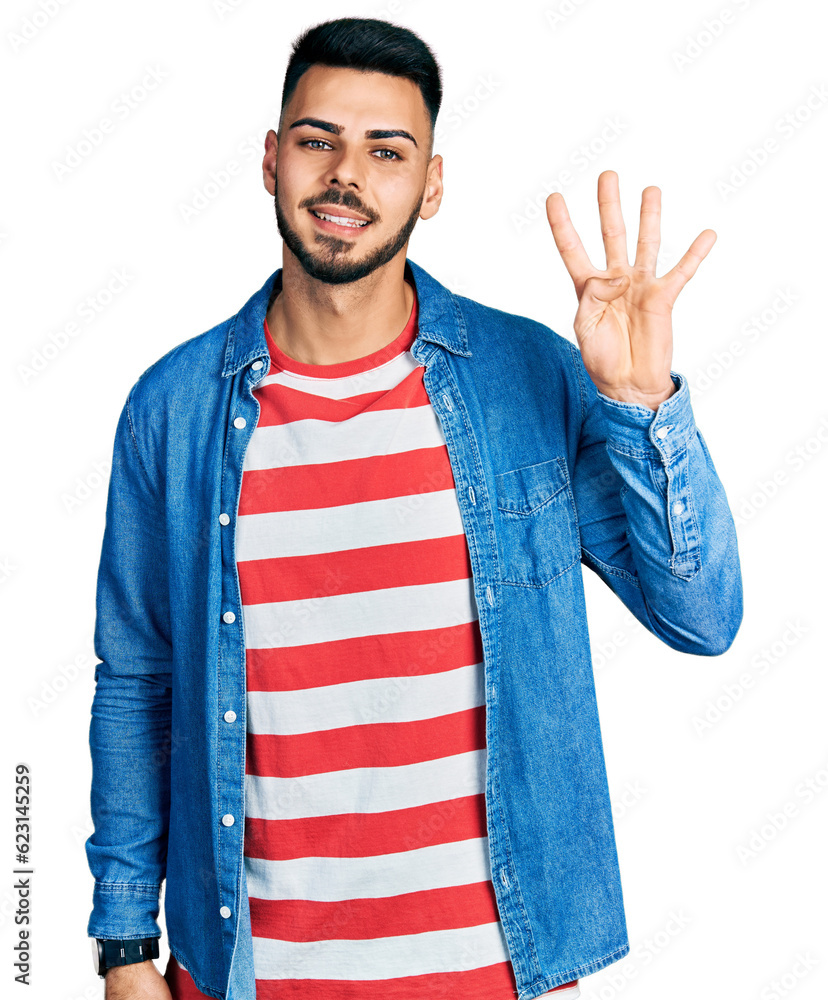Young hispanic man with beard wearing casual denim jacket showing and pointing up with fingers number four while smiling confident and happy. Young hispanic man with beard wearing casual denim jacket showing and pointing up with fingers number four while smiling confident and happy.