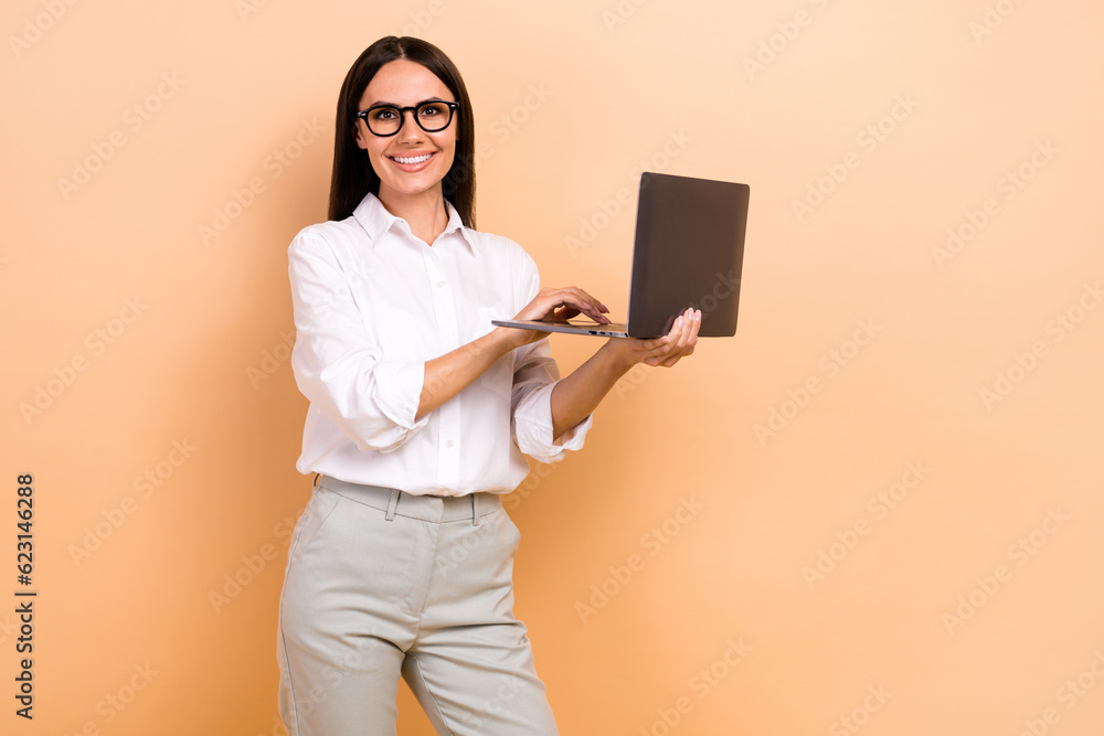 Photo of happy cheerful lady wear white shirt spectacles chatting modern device empty space isolated beige color background