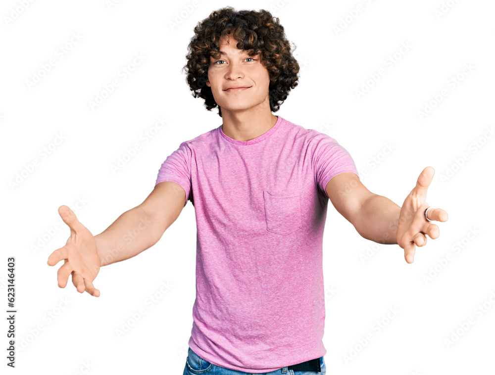 Caucasian teenager wearing casual clothes looking at the camera smiling with open arms for hug. cheerful expression embracing happiness. Caucasian teenager wearing casual clothes looking at the camera smiling with open arms for hug. cheerful expression embracing happiness.