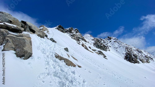 View of a snow-covered trail in the Altai mountains. Beautiful snowy mountain winter landscape. Climbing Mount Belukha.