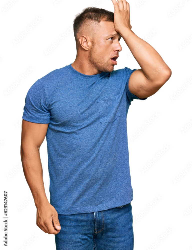Handsome muscle man wearing casual clothes surprised with hand on head for mistake, remember error. forgot, bad memory concept. Handsome muscle man wearing casual clothes surprised with hand on head for mistake, remember error. forgot, bad memory concept.