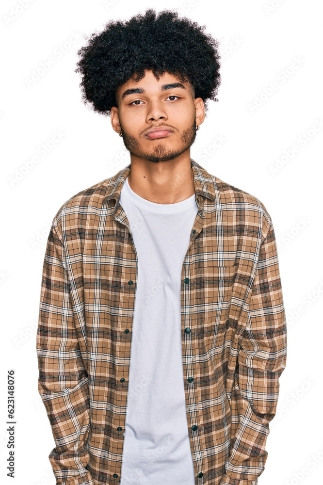 Young african american man with afro hair wearing casual clothes depressed and worry for distress, crying angry and afraid. sad expression. Young african american man with afro hair wearing casual clothes depressed and worry for distress, crying angry and afraid. sad expression.