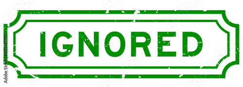 Grunge green ignored word rubber seal stamp on white background