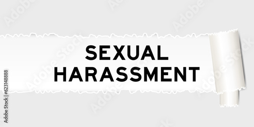 Ripped gray paper background that have word sexual harassment under torn part