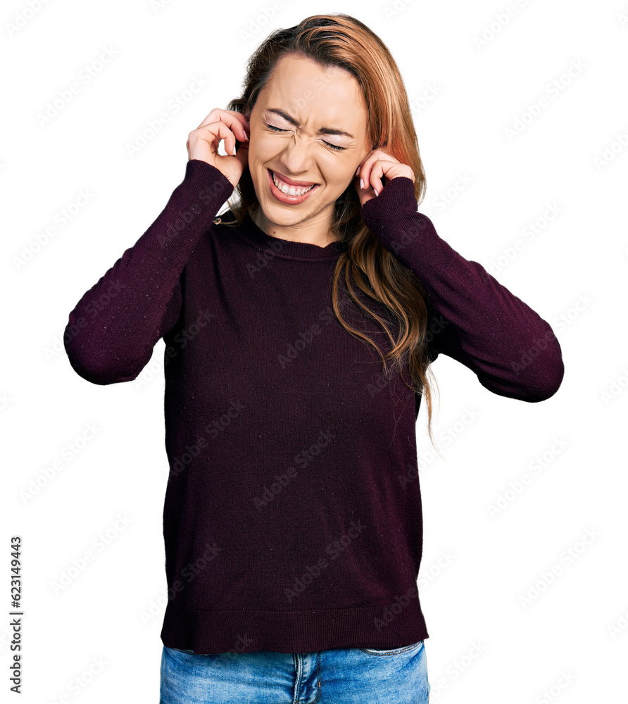 Young caucasian woman wearing casual clothes covering ears with fingers with annoyed expression for the noise of loud music. deaf concept. Young caucasian woman wearing casual clothes covering ears with fingers with annoyed expression for the noise of loud music. deaf concept.