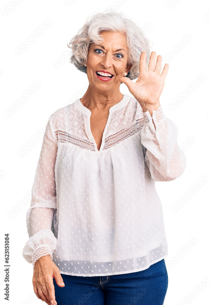 Obraz premium Senior grey-haired woman wearing casual clothes showing and pointing up with fingers number five while smiling confident and happy.