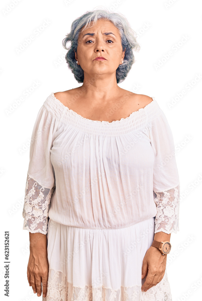 Senior woman with gray hair wearing bohemian style looking sleepy and tired, exhausted for fatigue and hangover, lazy eyes in the morning. Senior woman with gray hair wearing bohemian style looking sleepy and tired, exhausted for fatigue and hangover, lazy eyes in the morning.