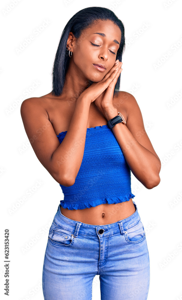 Young african american woman wearing casual summer clothes sleeping tired dreaming and posing with hands together while smiling with closed eyes. Young african american woman wearing casual summer clothes sleeping tired dreaming and posing with hands together while smiling with closed eyes.