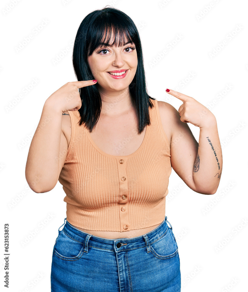 Young hispanic plus size woman wearing casual clothes smiling cheerful showing and pointing with fingers teeth and mouth. dental health concept. Young hispanic plus size woman wearing casual clothes smiling cheerful showing and pointing with fingers teeth and mouth. dental health concept.