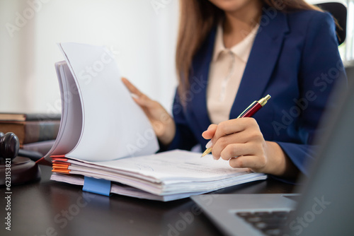 Bild auf Leinwand A team of lawyers is consulting and examining legal matters from law books to assist clients who come to consult legal issues regarding litigation