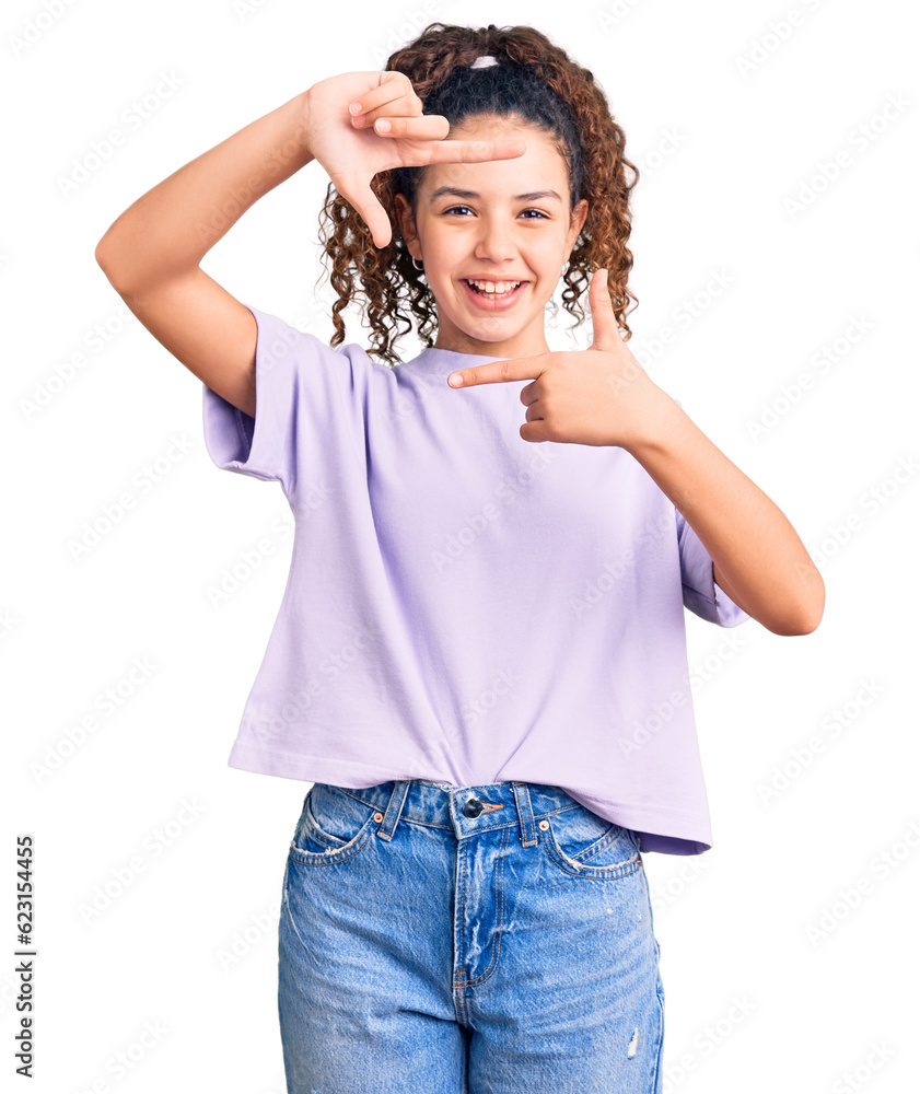 Beautiful kid girl with curly hair wearing casual clothes smiling making frame with hands and fingers with happy face. creativity and photography concept. Beautiful kid girl with curly hair wearing casual clothes smiling making frame with hands and fingers with happy face. creativity and photography concept.